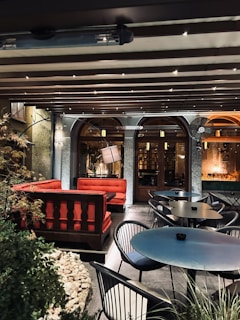 Screenshot of a relaxing garden cafe game featuring cozy outdoor seating and colorful plant decorations