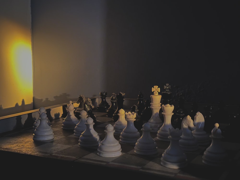 a group of chess pieces sitting on top of a chess board