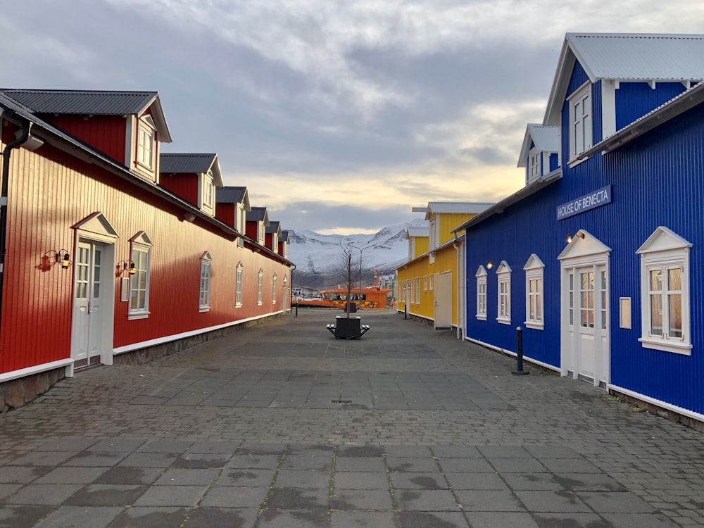 a row of colorful houses on a cobblestone street