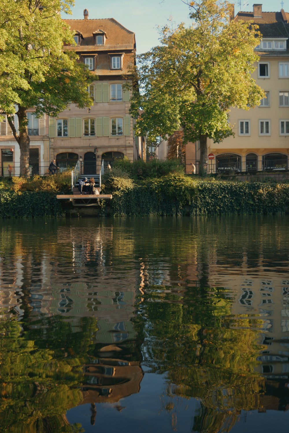 a body of water surrounded by tall buildings