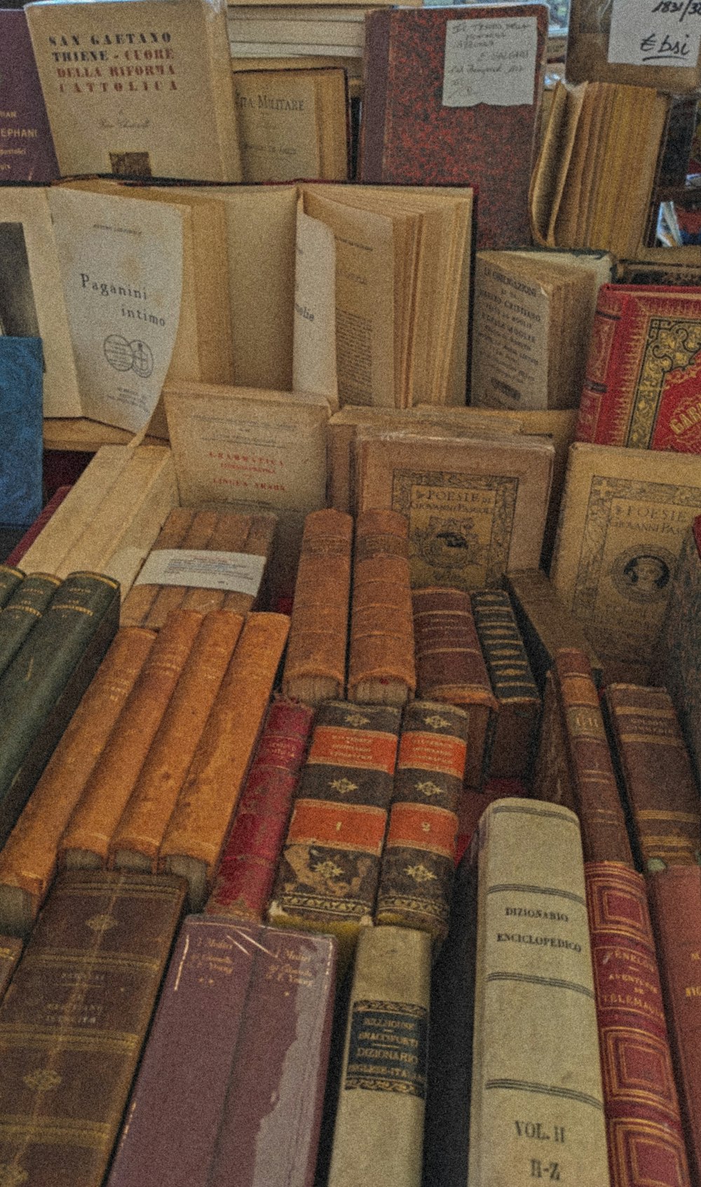 a pile of books sitting on top of a table