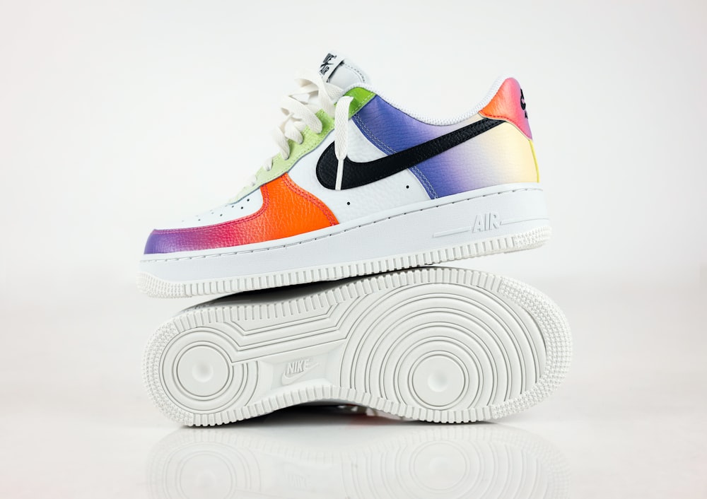 a pair of colorful sneakers on top of each other