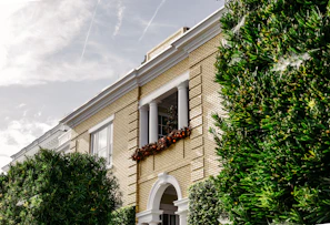 Exterior repair and fresh paint on a brick apartment building in metro Atlanta