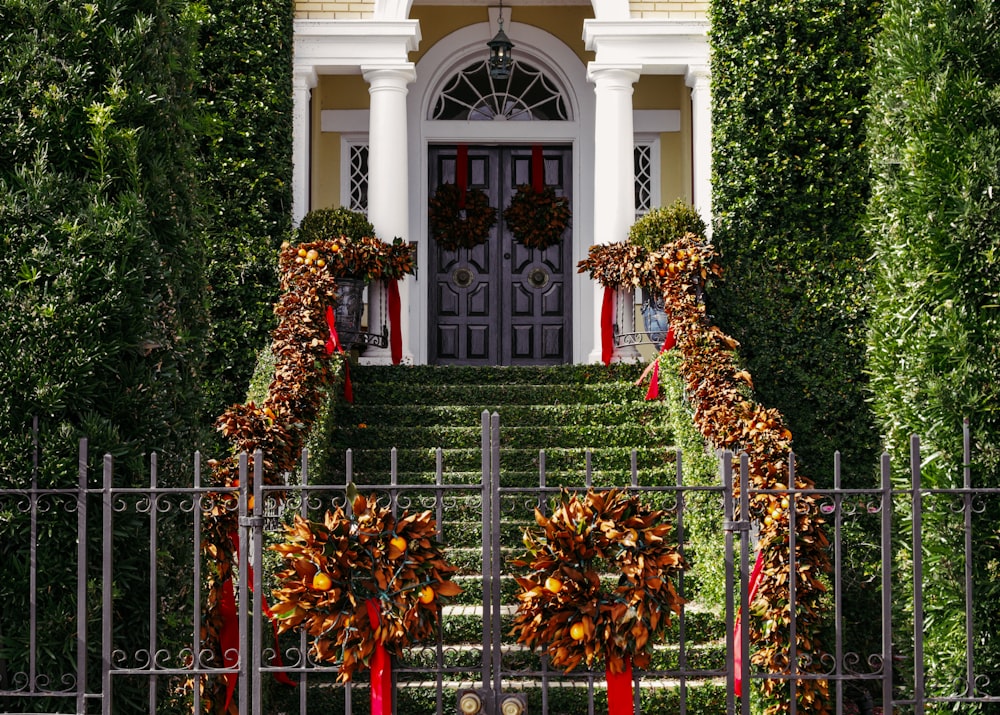 a set of stairs decorated with wreaths and ribbons