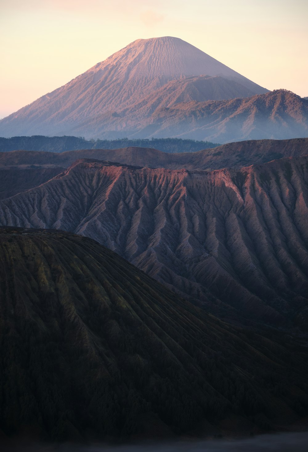 a view of a mountain with a very tall peak