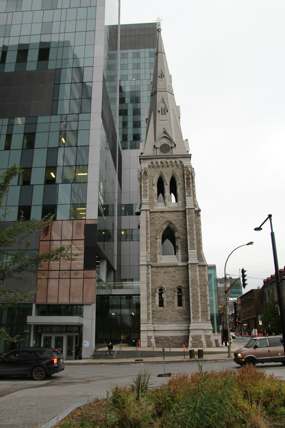 a tall clock tower sitting next to a tall building