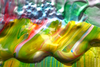 A vibrant painting of swirling colors blending into a serene landscape.