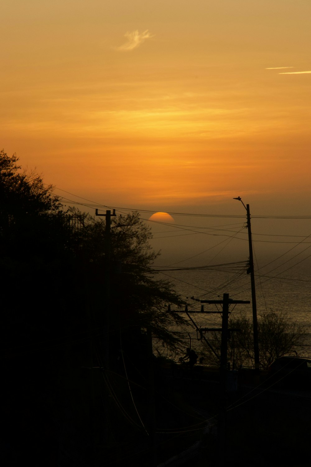 the sun is setting over a body of water