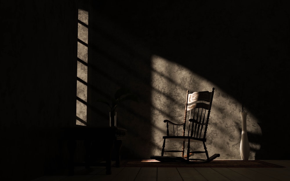 a rocking chair sitting in a dark room