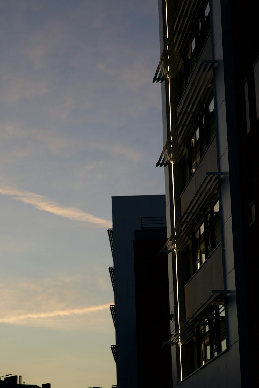 a tall building with a sky in the background