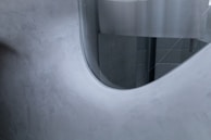 Aluminum radiator with a smooth finish blending into a contemporary office space.