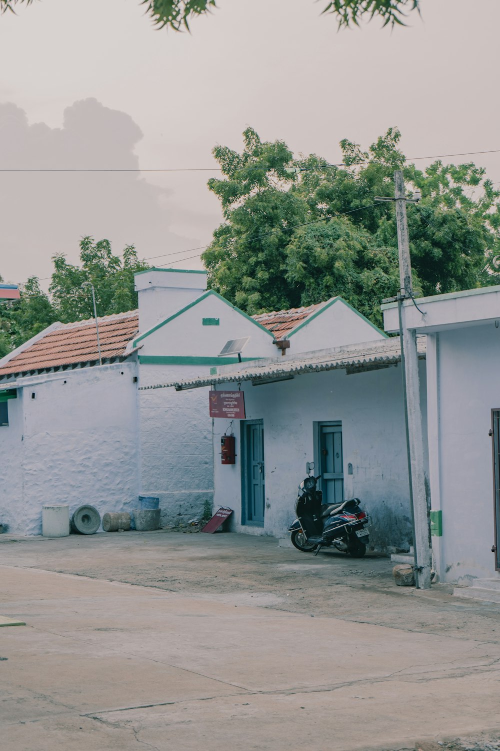 a motorcycle parked in front of a white building