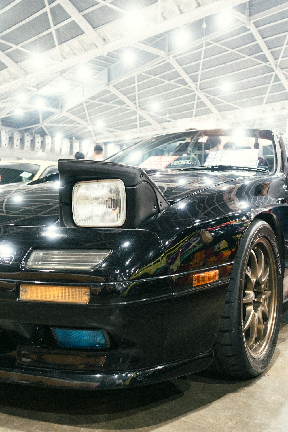 a black sports car parked in a garage