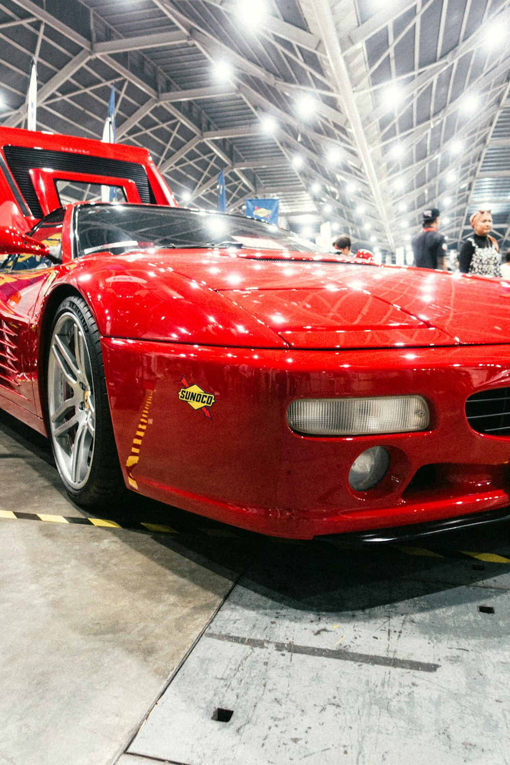 a red sports car parked in a garage