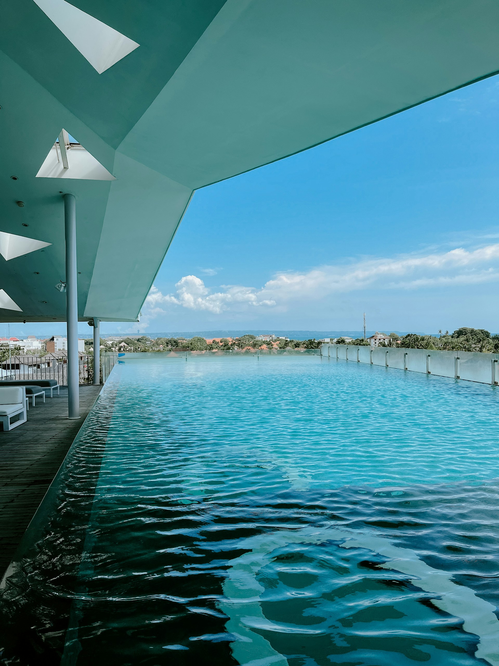 woman wearing yellow long-sleeved dress under white clouds and blue sky during daytime