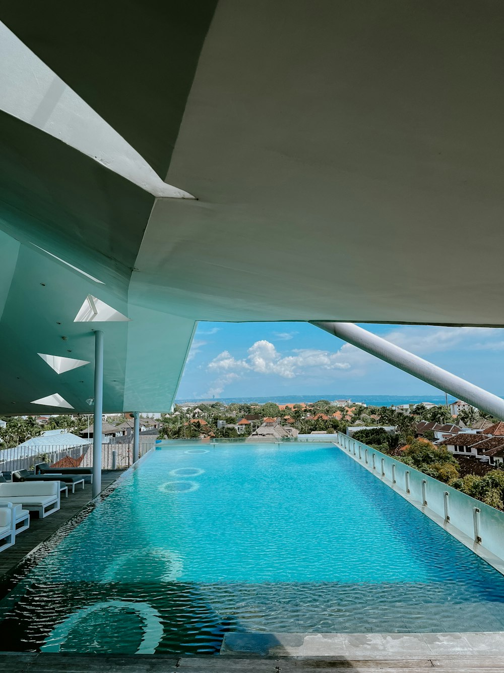 a large swimming pool with a view of a city