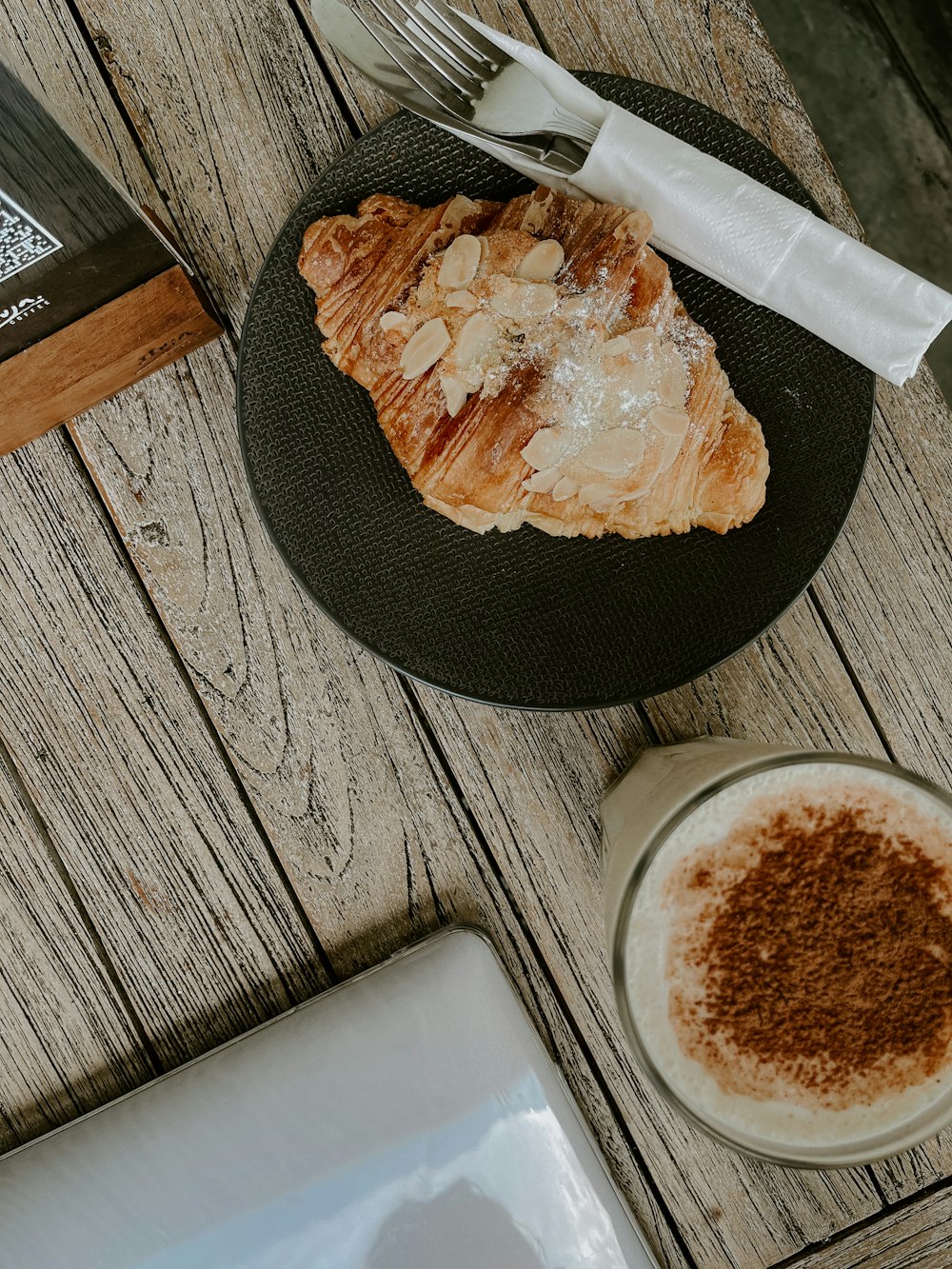 a plate of food and a cup of coffee on a table