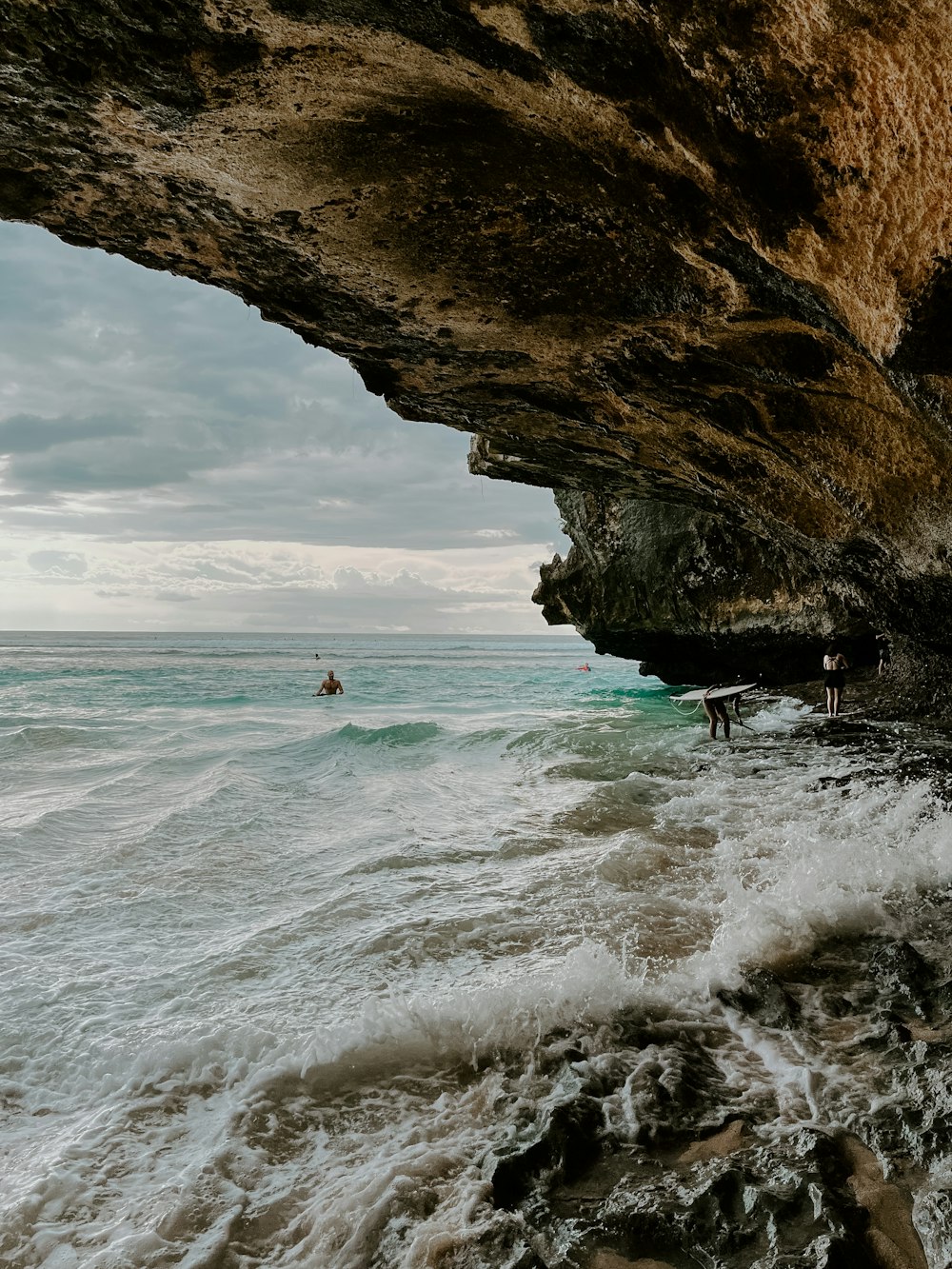 a person riding a surfboard on a wave in the ocean