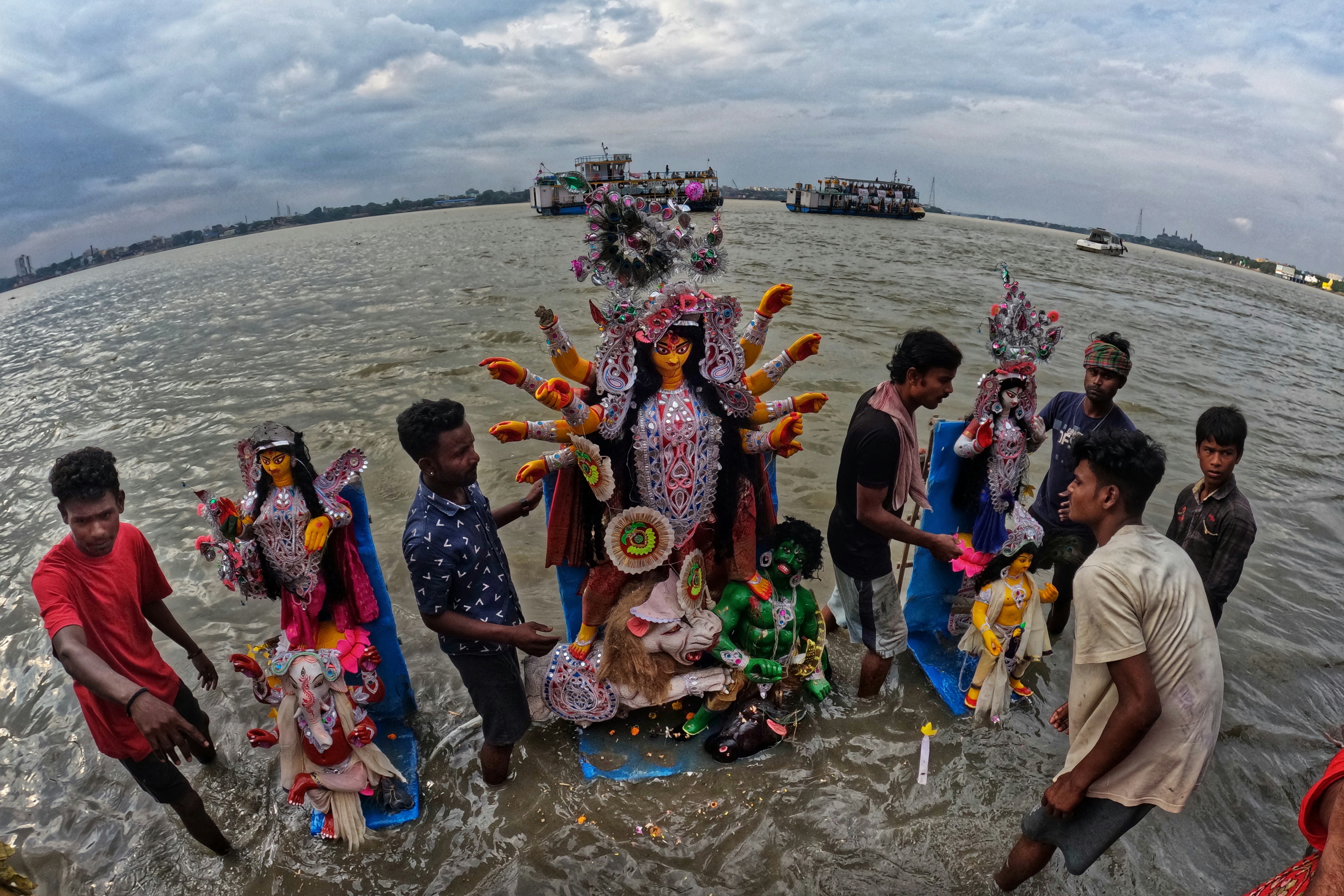 A group of people standing in a body of water