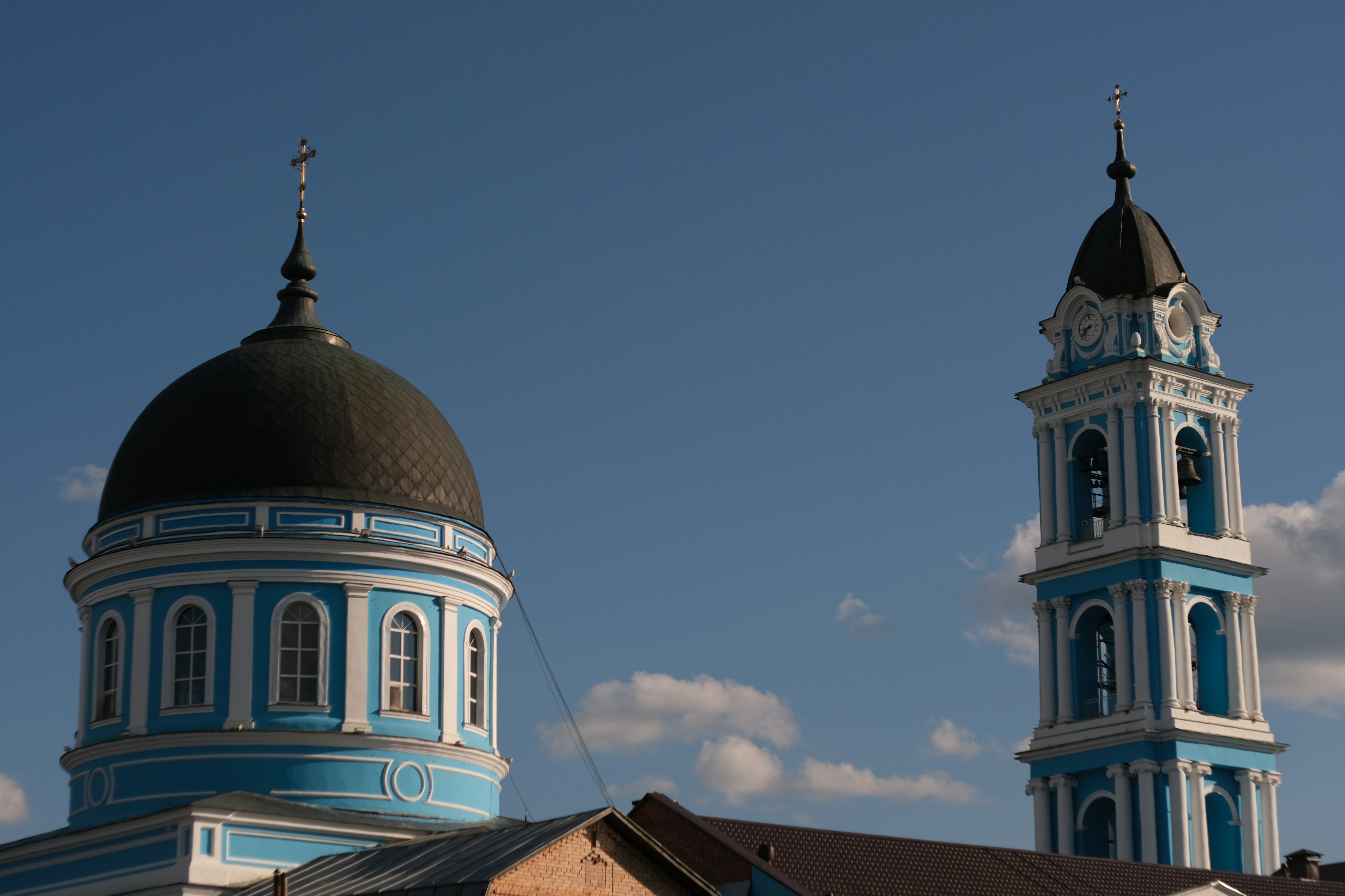 a blue and white building with two towers