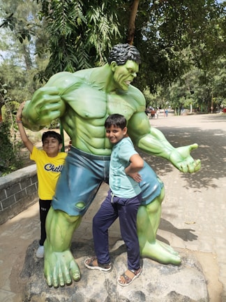Angel mascot posing with kids in a sunny park setting