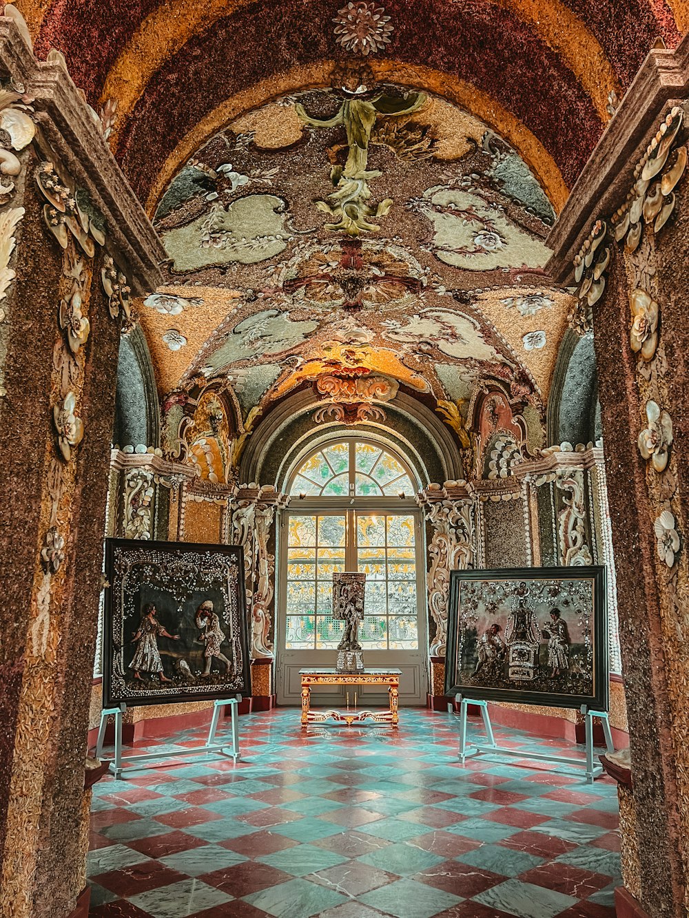 a room with paintings and paintings on the walls