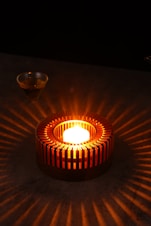 a lit candle sitting on top of a table