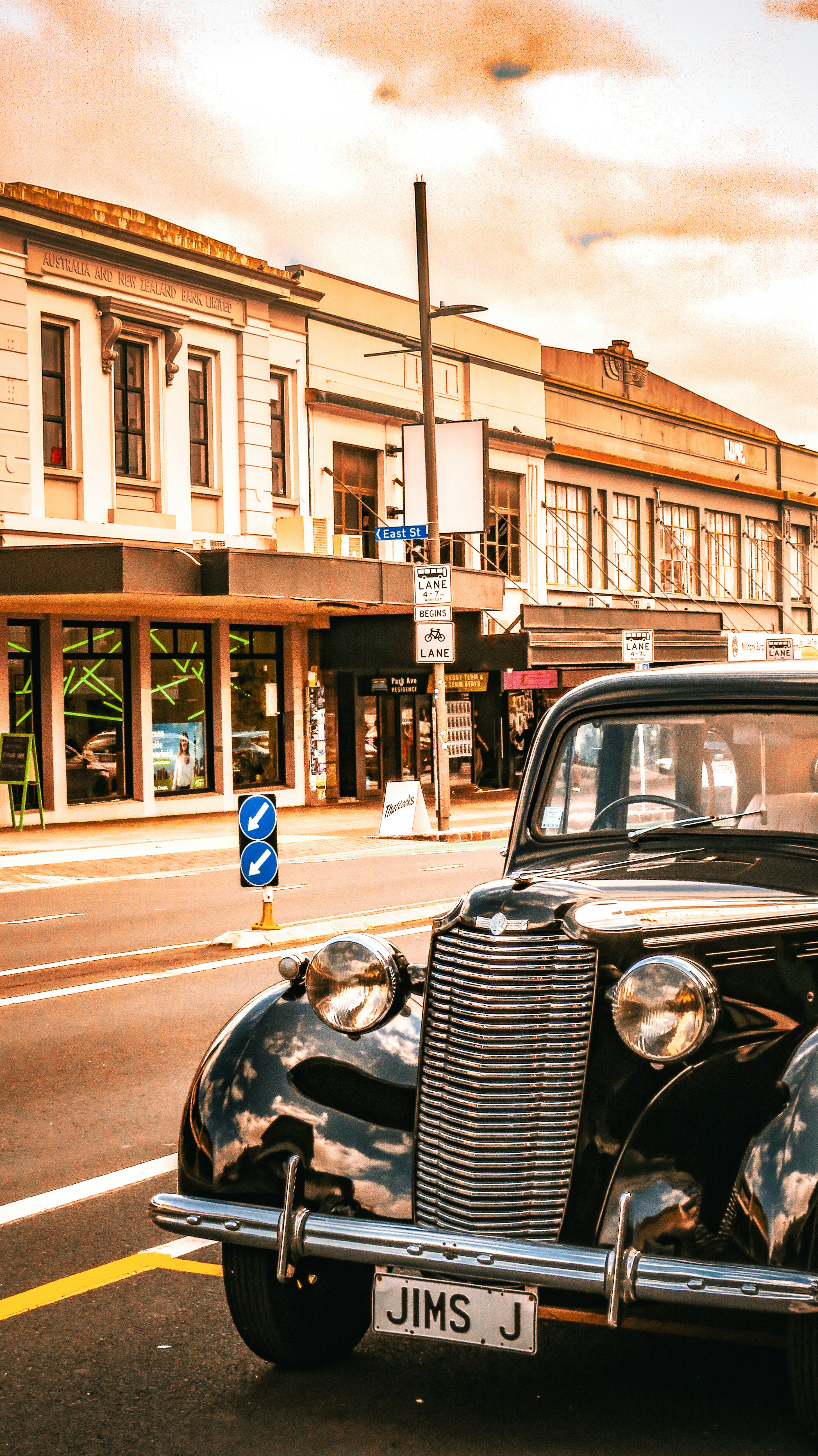 a classic car parked on the side of the road