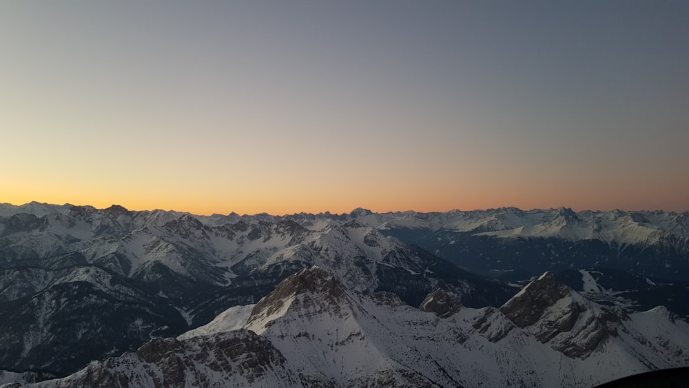 a view of a mountain range at sunset