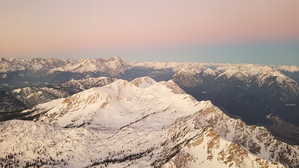 a view of a mountain range covered in snow