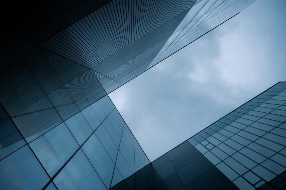 a very tall building with many windows and a sky background