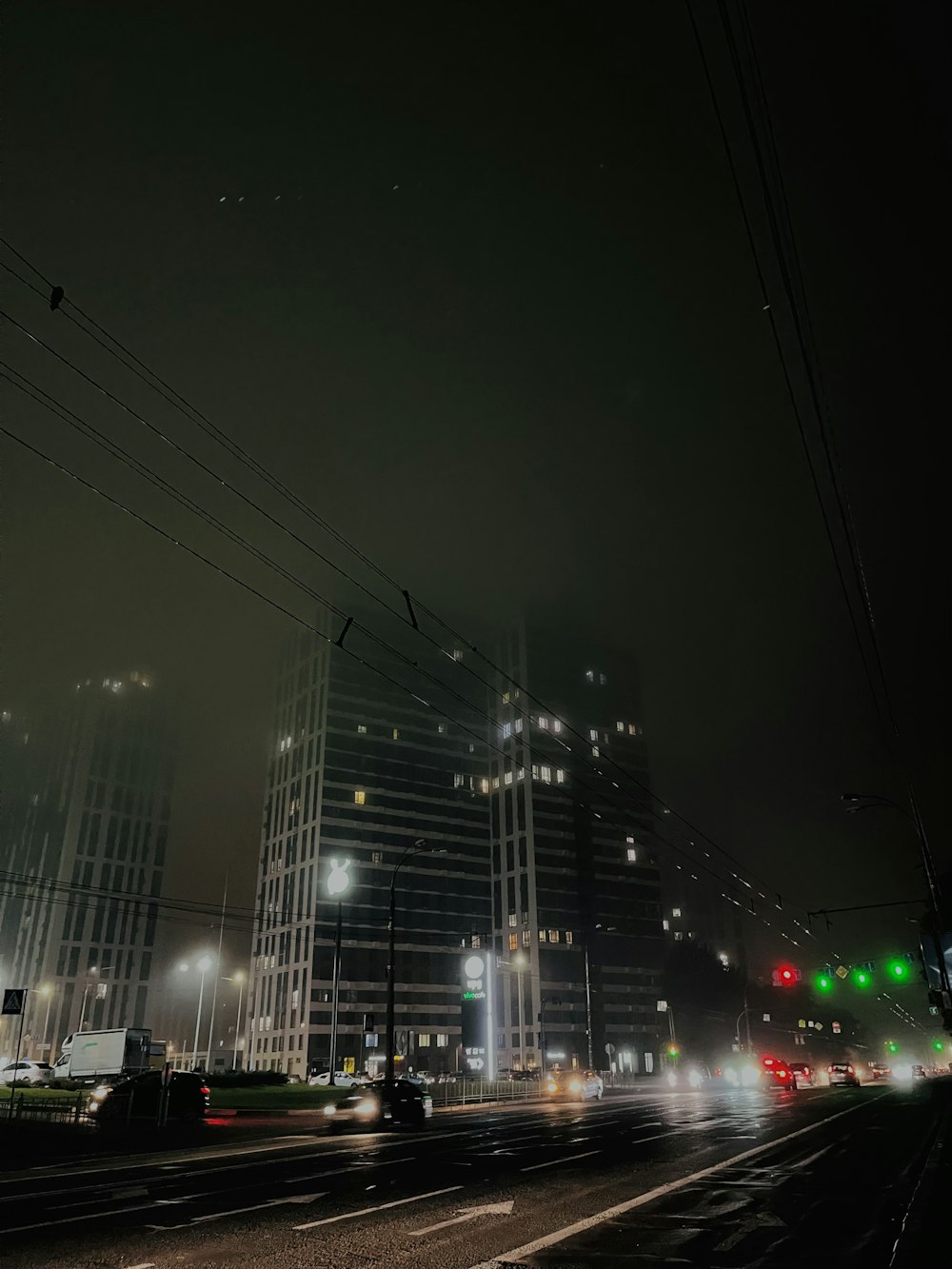 a city street at night with a lot of traffic