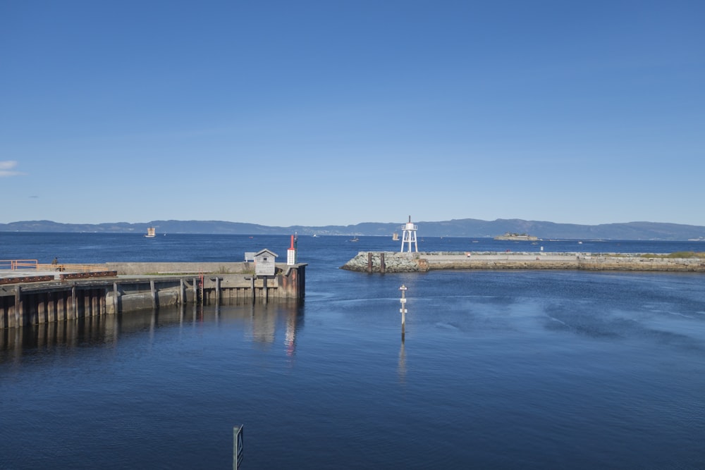 a large body of water next to a dock