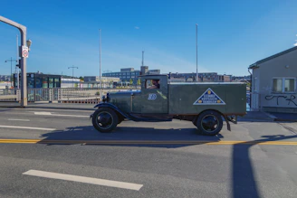 A delivery truck emitting green leaves symbolizing reduced carbon footprint.