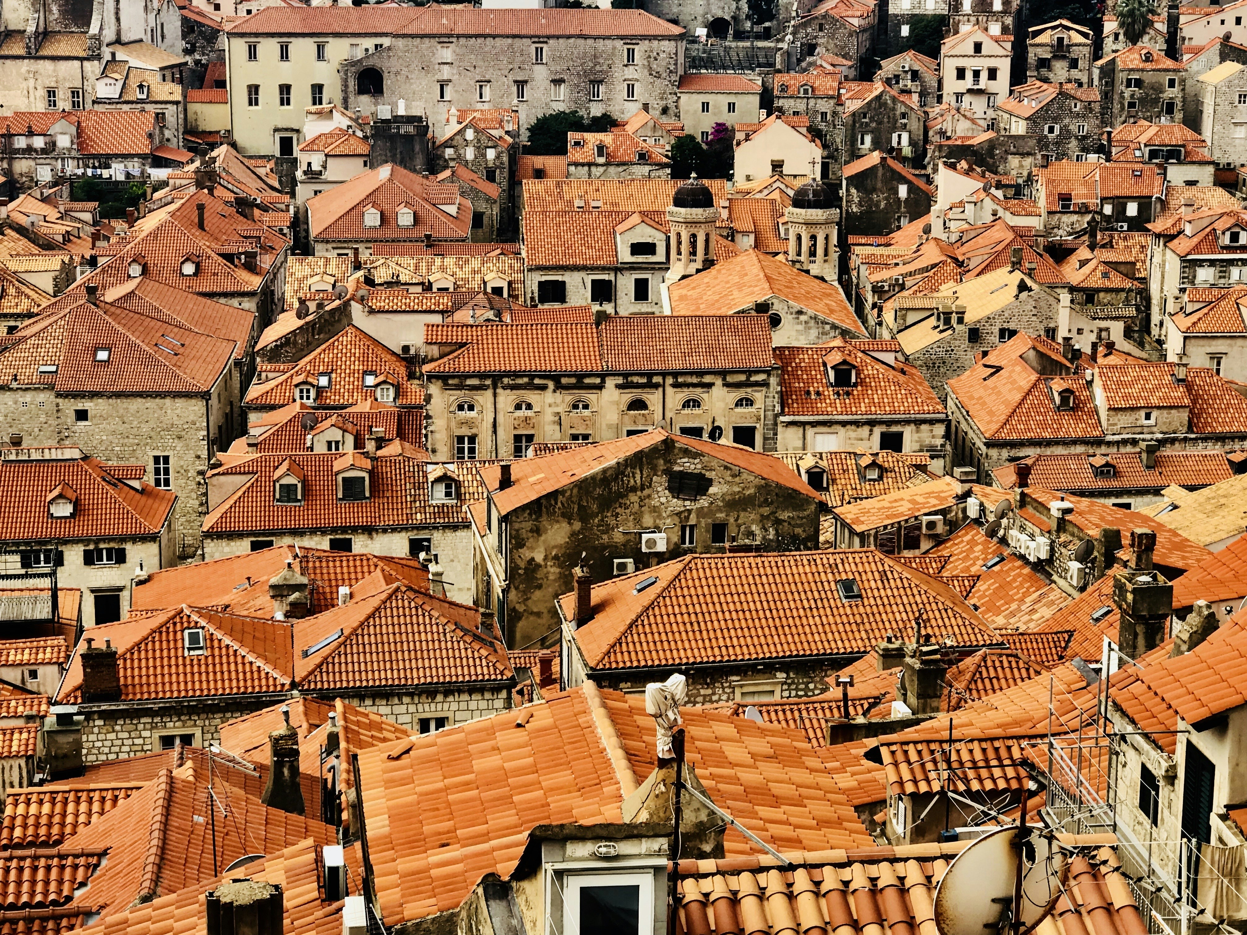 A large group of buildings with orange roofs