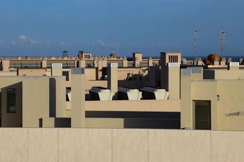 Close-up of air quality sensors mounted on an urban rooftop.