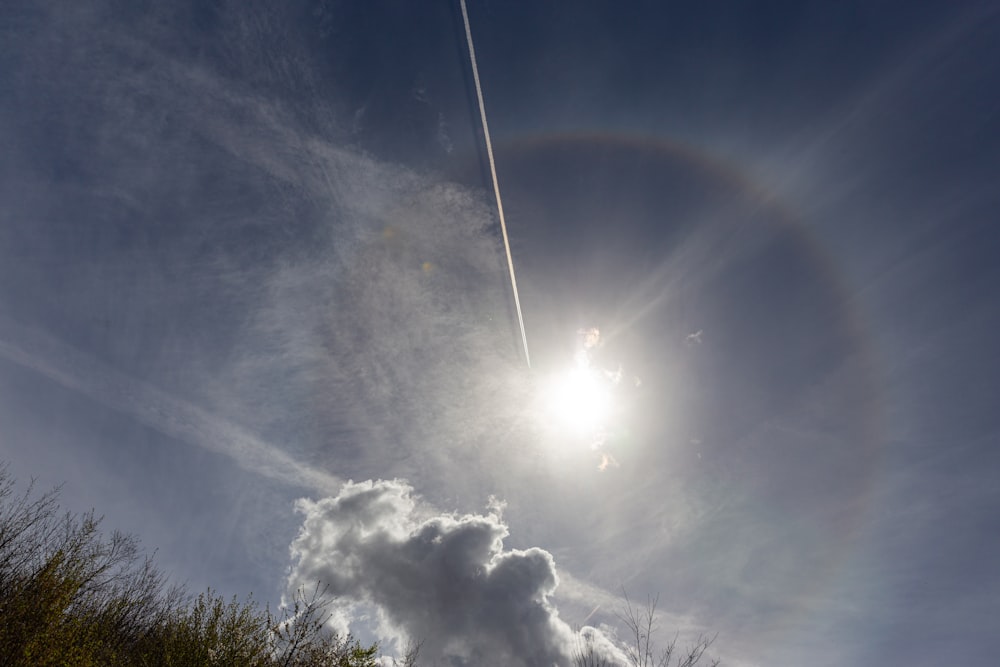 the sun is shining brightly through the clouds