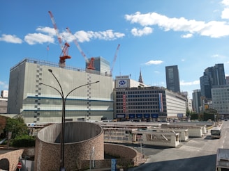 A panoramic shot of a bustling construction site showcasing workers collaborating on a sustainable urban infrastructure project.