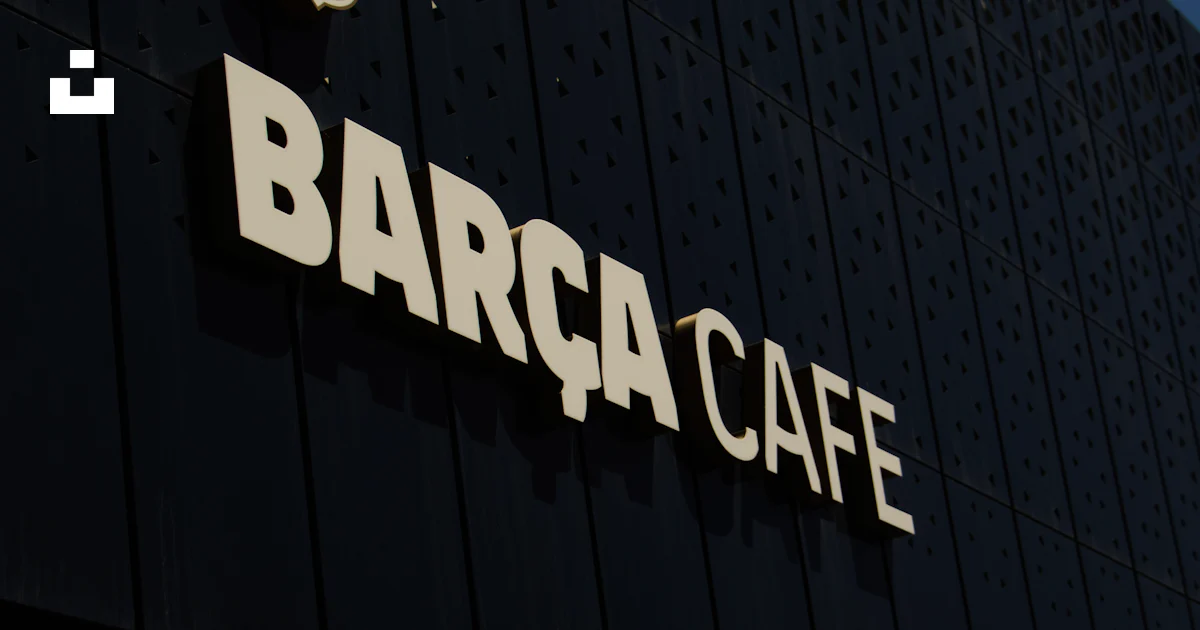 Berca Sign A barca cafe sign on the side of a building photo – Free Building Image ...