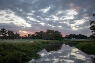 A serene landscape featuring a woman enjoying a peaceful moment in nature, symbolizing reflection and personal growth.