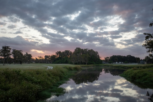 A serene landscape featuring a woman enjoying a peaceful moment in nature, symbolizing reflection and personal growth.