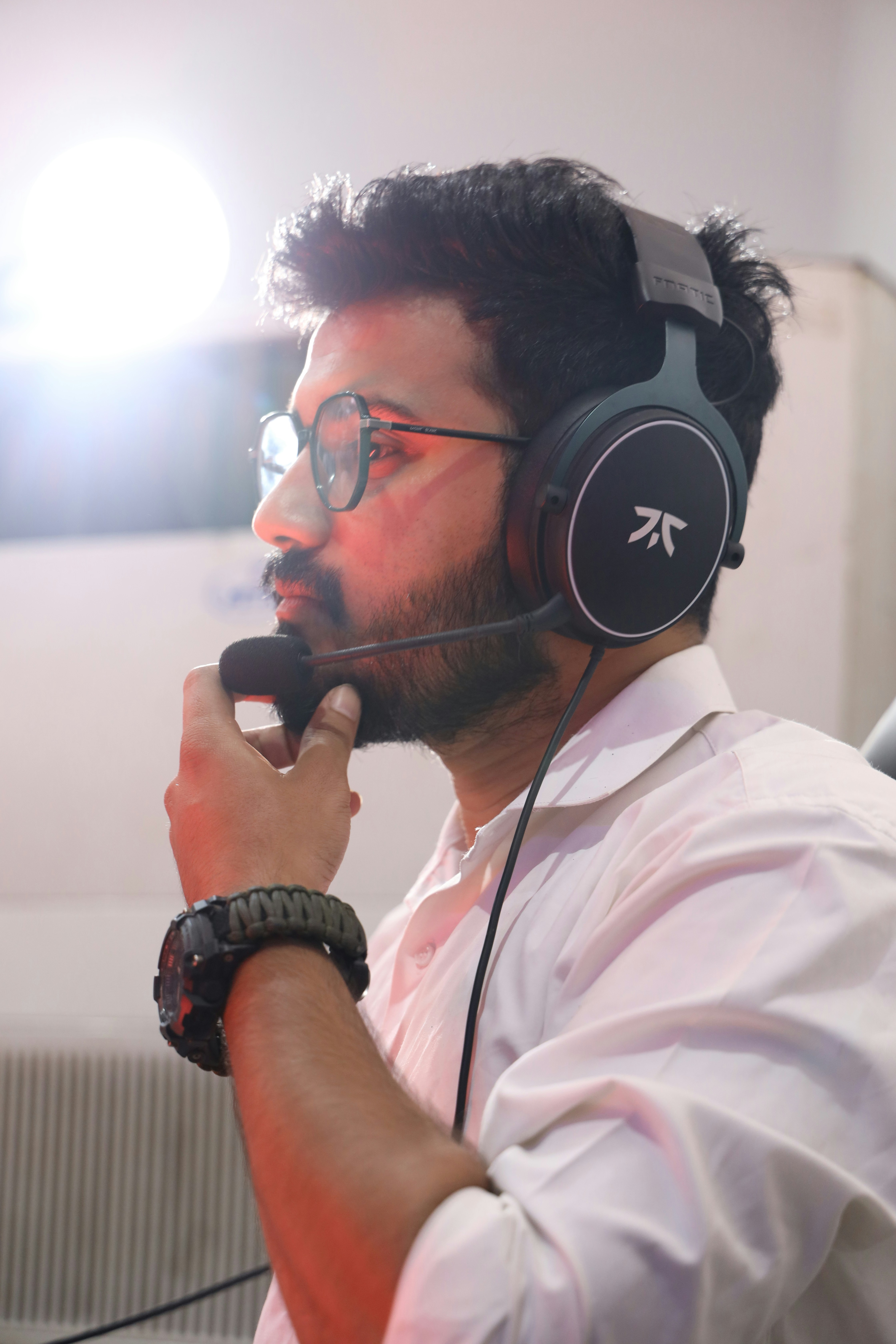 A man wearing headphones and holding a microphone photo – Free Grey ...