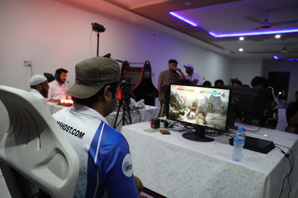 A vibrant group of diverse gamers gathered around screens, sharing excitement and teamwork.