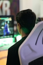 A gamer excitedly watching their Wuthering Waves character level up on screen.