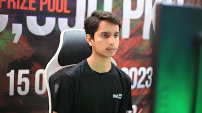 A close-up of a player focused on a competitive game.