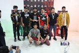 Group of young athletes relaxing in a hotel lounge area after a tournament.