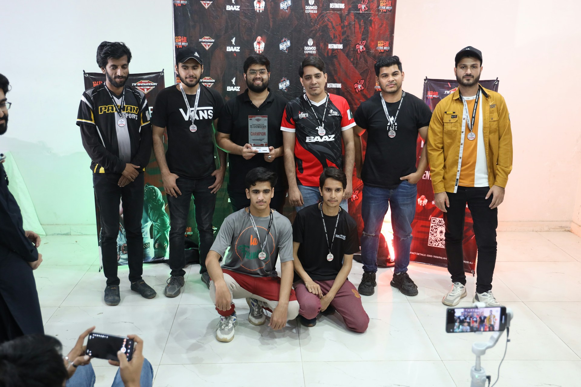A joyful group photo of club members celebrating a memorable tournament victory, showcasing camaraderie and Dominican culture.