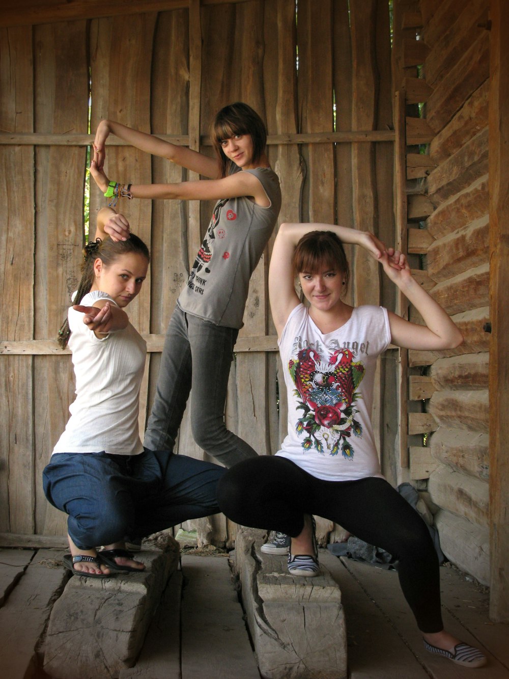 a group of young women standing next to each other