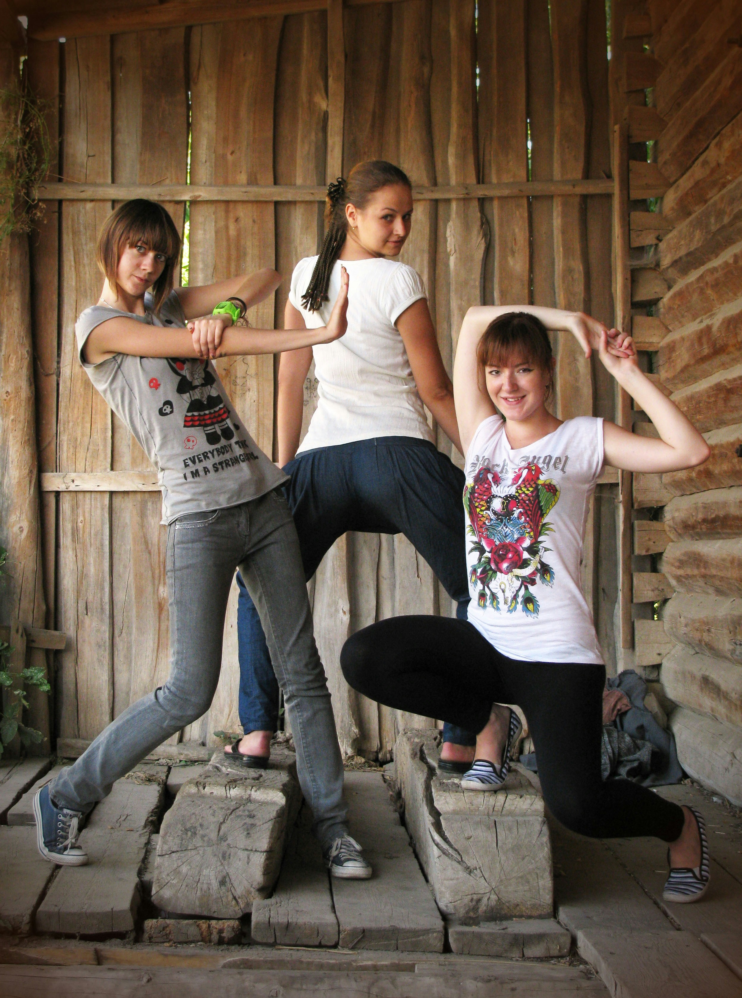a group of young women standing next to each other