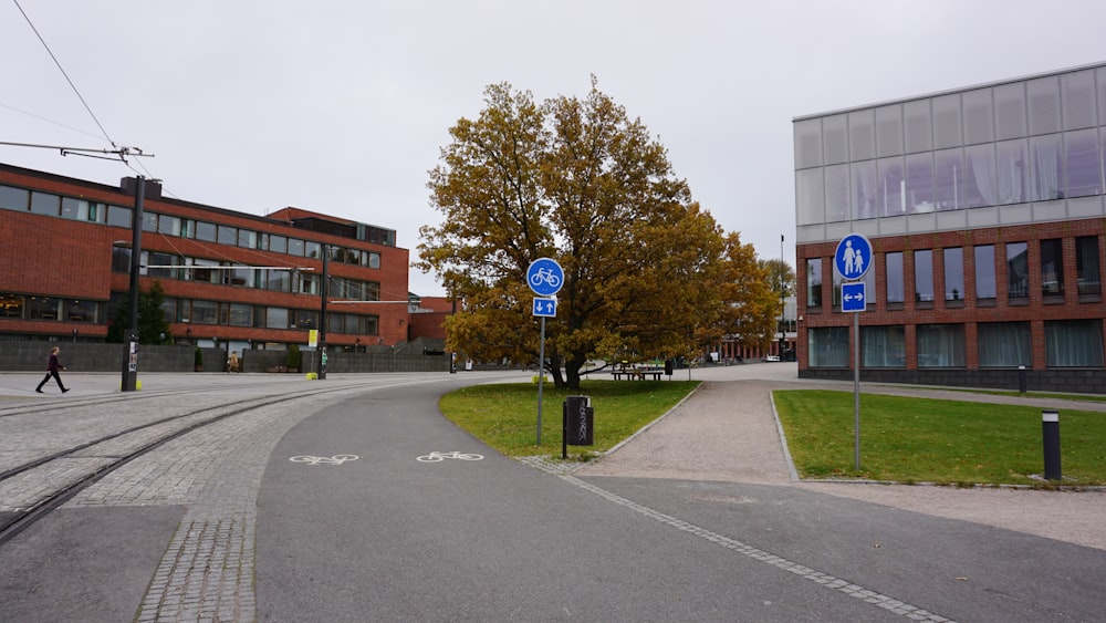 a person walking down a street next to a building